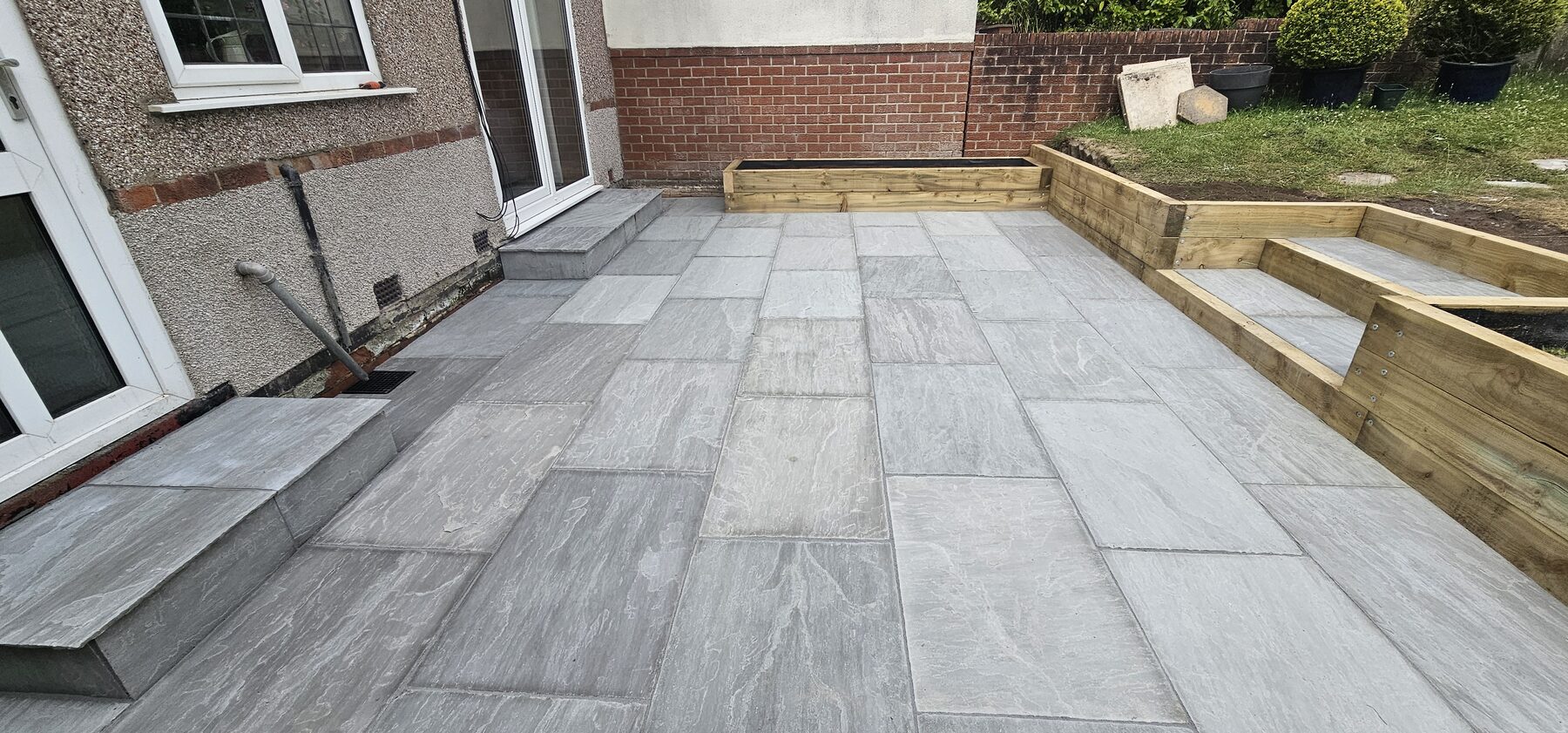 Completed Silver Stone project: renovated garden with Silver Stone paving, wider steps and a raised bed